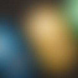 An overhead shot of stacked barbell plates on a gym floor.