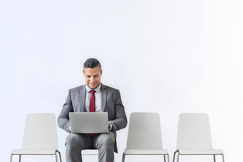 senior-businessman-working-laptop-room.jpg