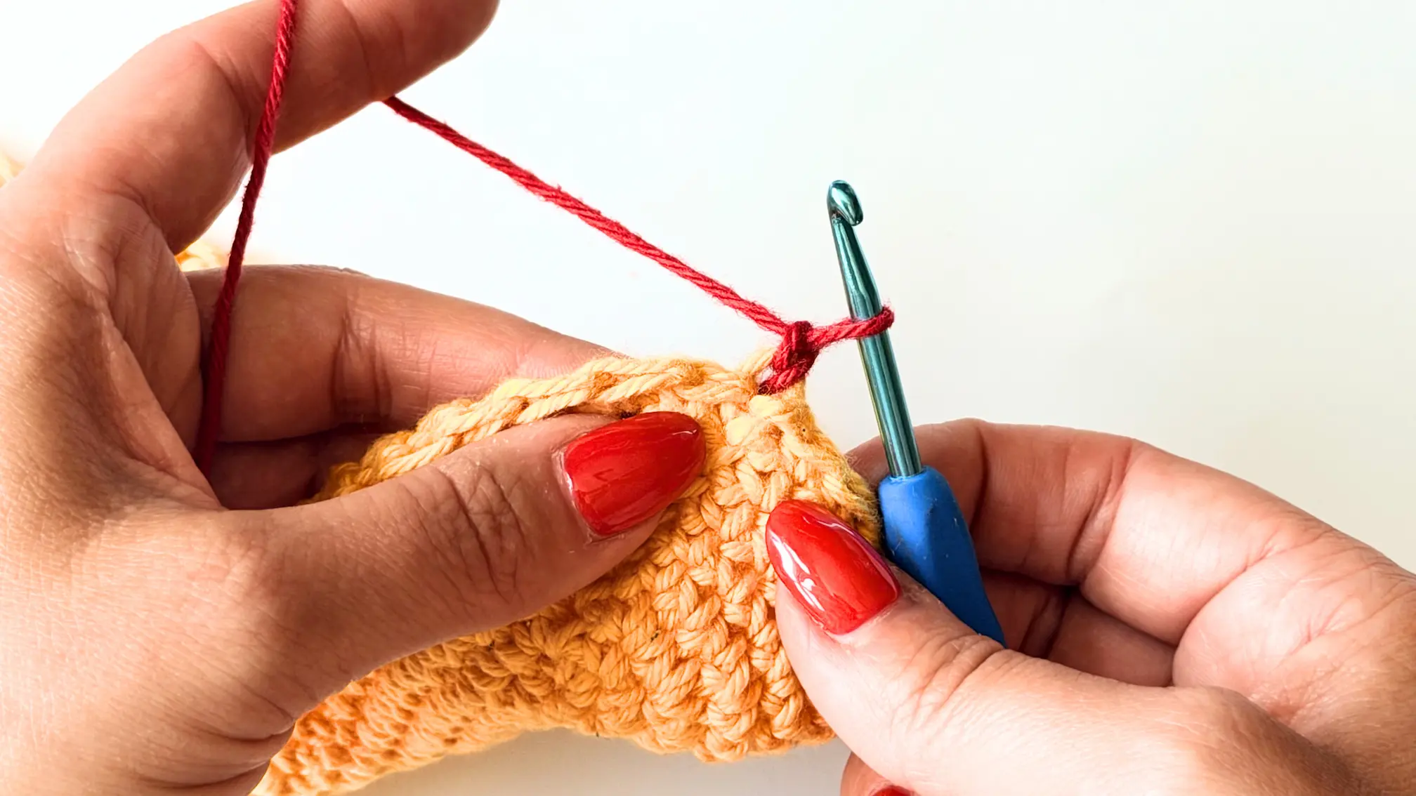 Pull up a loop and make it slightly longer to begin the invisible Double Crochet.