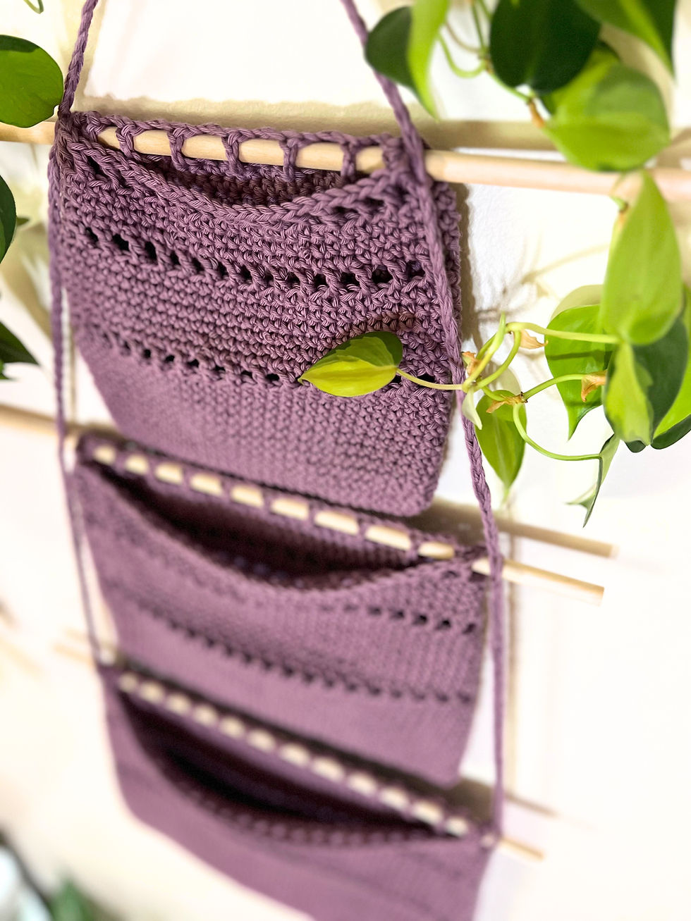 Thumbnail: Detail of crochet pocket wall organizer showing texture and stitches.