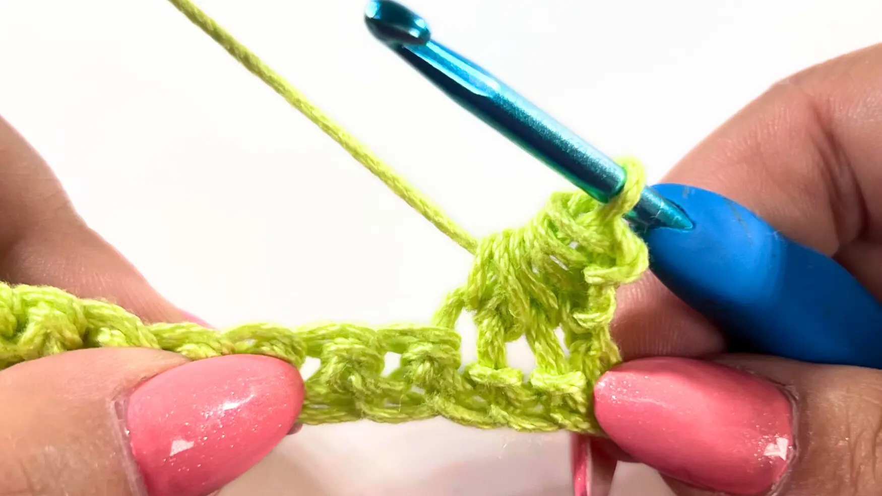 Completed pull-through of all six loops with the hook, finishing the first Star Stitch cluster.