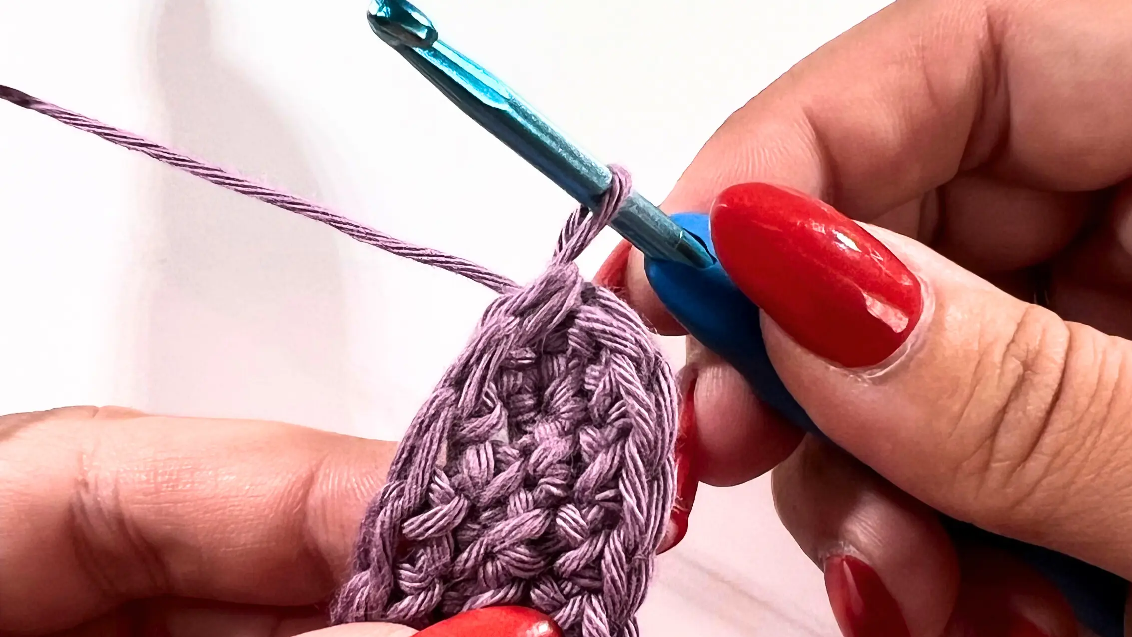 Crochet stitches tightened neatly while working invisible join technique.