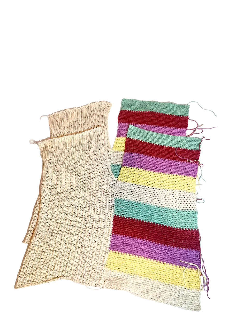 Two crochet sweater panels laid side by side, one in solid beige and the other in colourful horizontal stripes, ready for assembly.