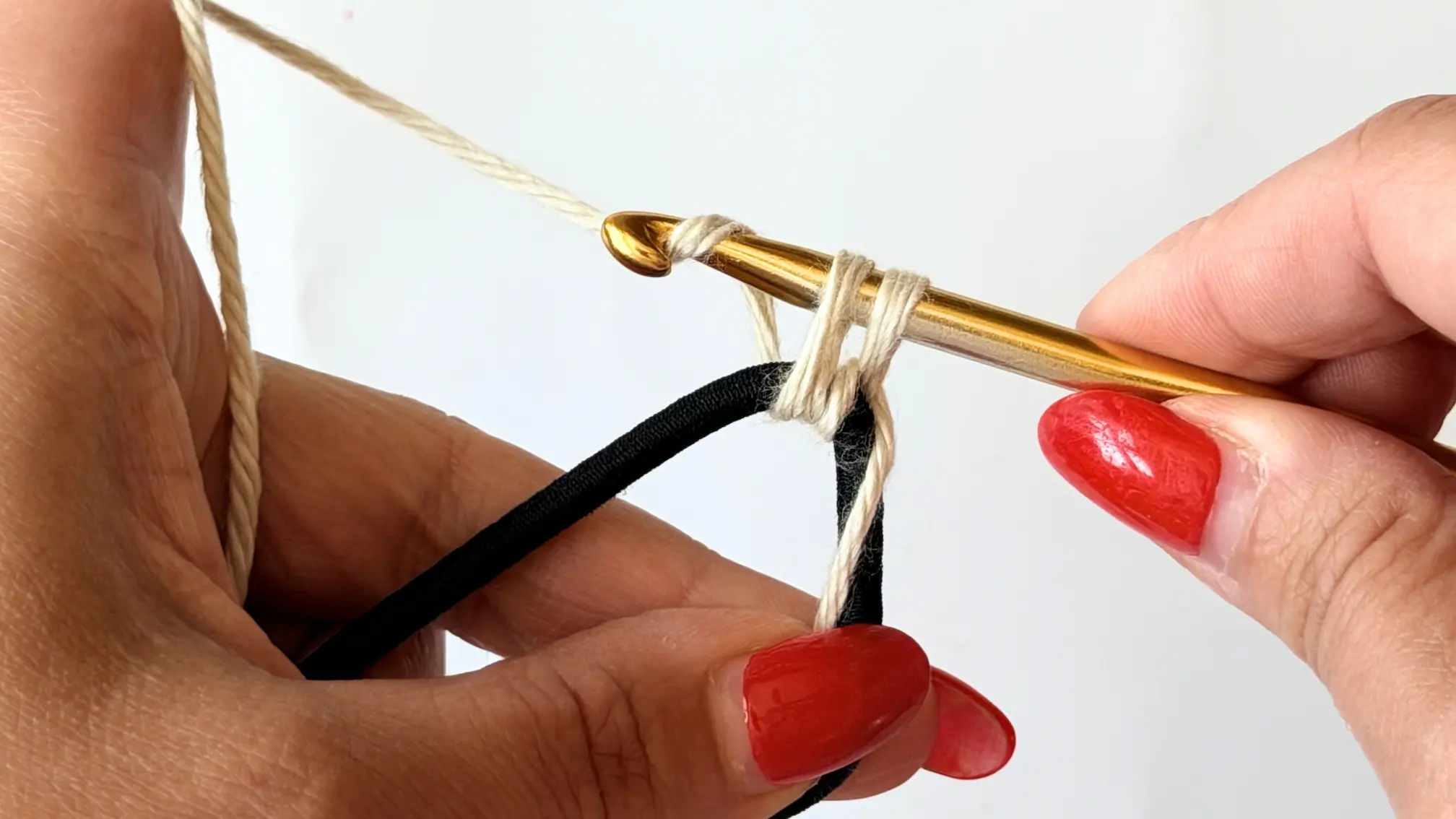 Beginning a single crochet around the hair elastic