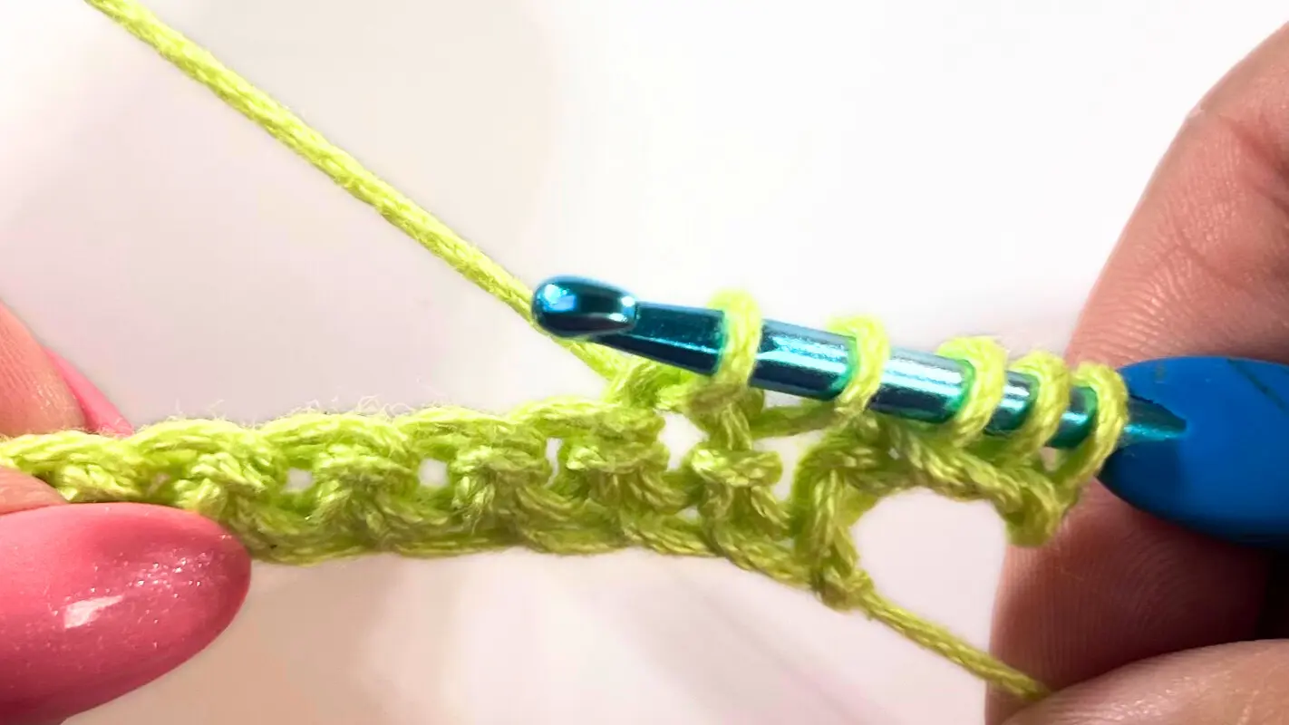 Five loops on the hook while creating the first Star Stitch across the foundation chain.