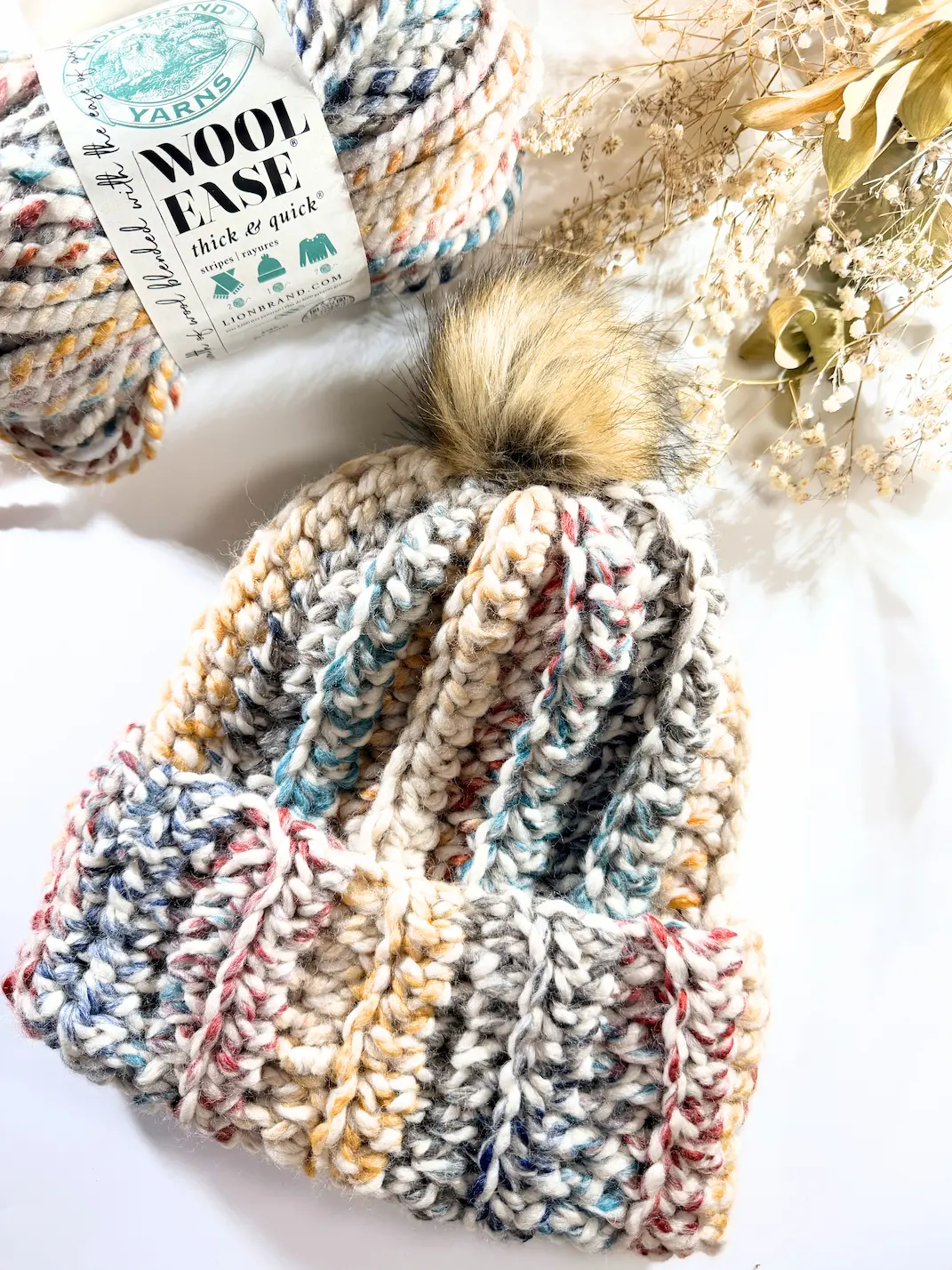 Top view of easy chunky crochet beanie in Lion Brand Wool-Ease Thick & Quick yarn, showing textured vertical stitches and folded brim.