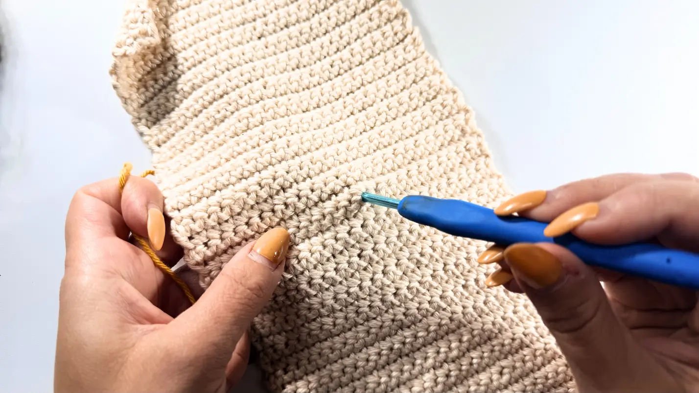 Finding the starting point for the surface crochet design on The Cozy Reader Sleeve crochet pattern.