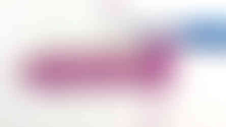 Arrows indicating alternating stitches for the rest of the row of the Alpine Stitch. Pink yarn and blue hook on a white background.