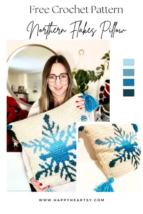 Crocheted Northern Flakes pillow case with a snowflake colourwork motif and tassels on the corners.