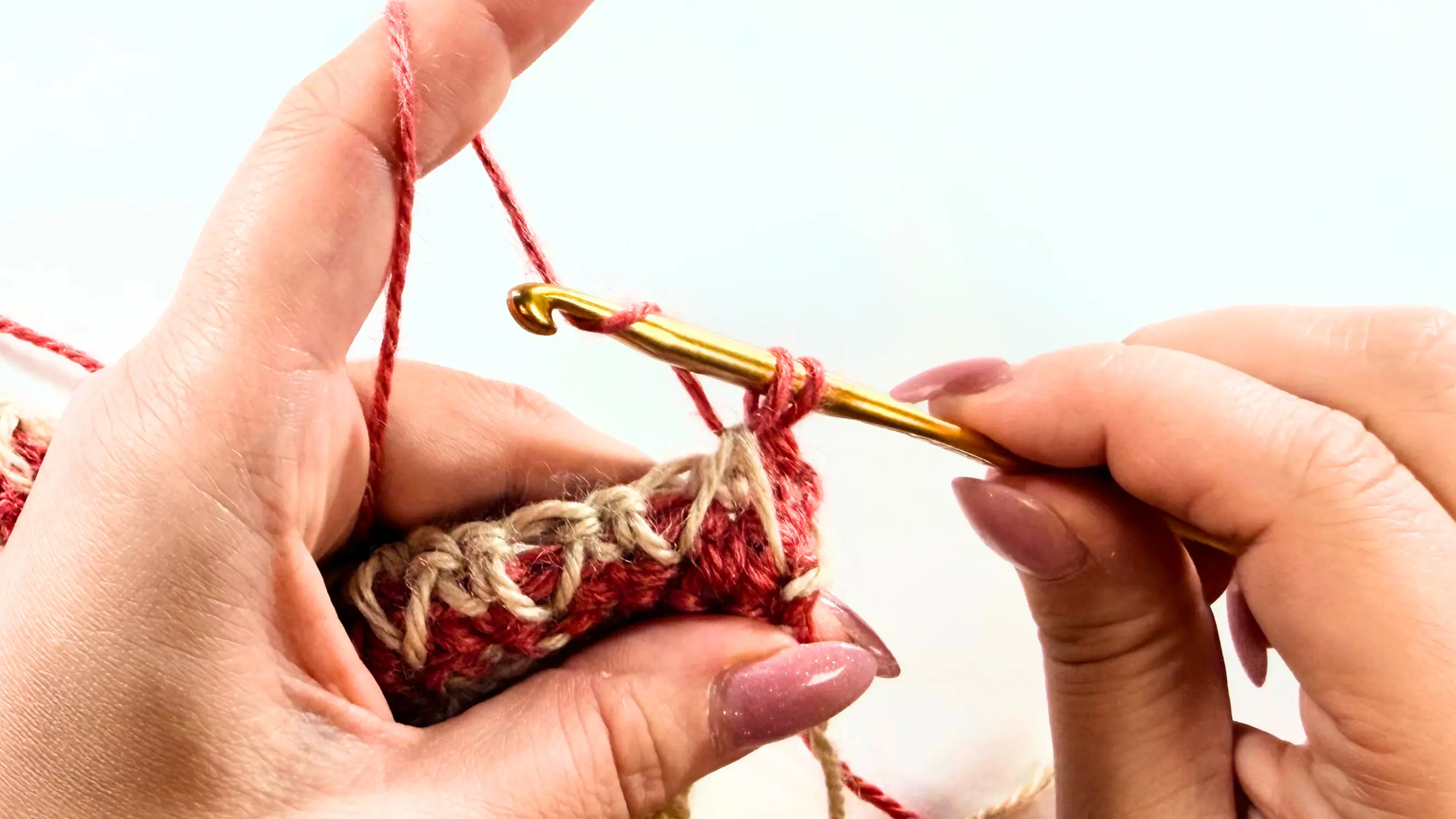 Honeycomb stitch crochet step highlighting where spike stitches are worked across the row