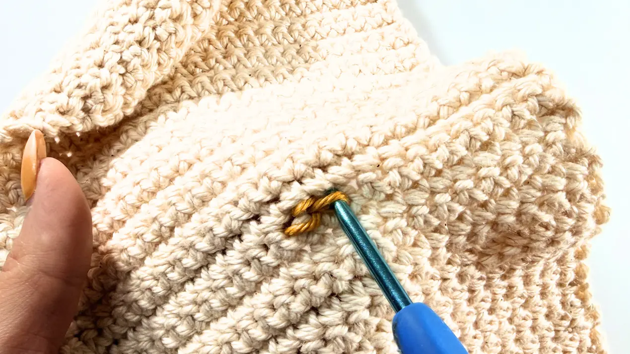 Completed first surface slip stitch on The Cozy Reader Sleeve crochet pattern.