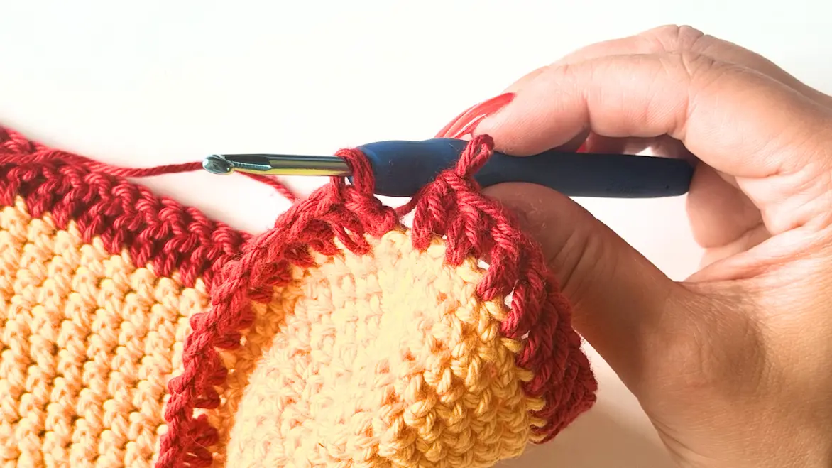Completing the invisible join at the end of the Double Crochet round.
