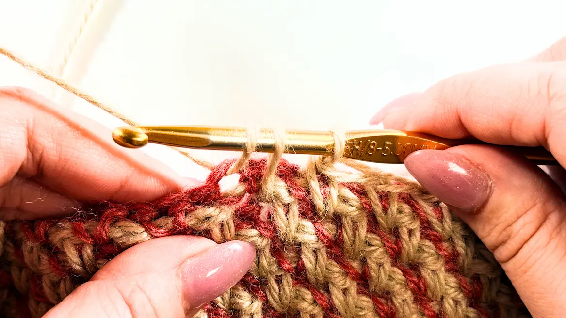 Honeycomb stitch crochet decrease step showing spike stitch worked together with a single crochet stitch