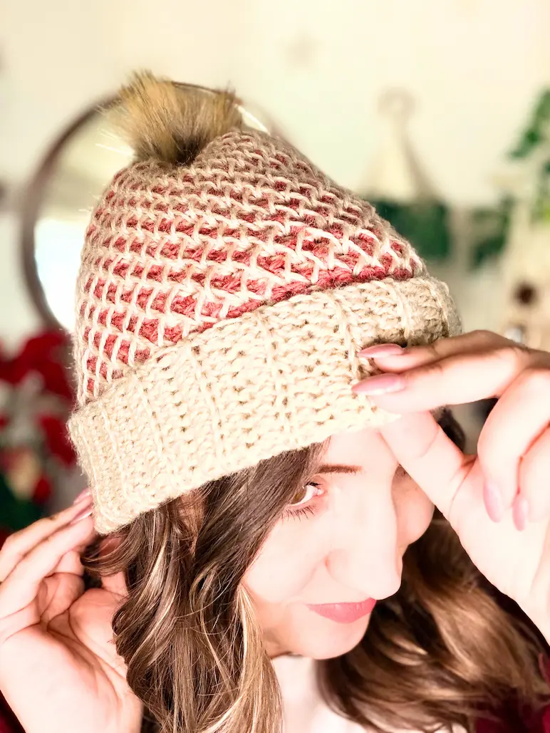 Finished Honeycomb Beanie crochet hat with ribbed brim and pompom, worn and styled