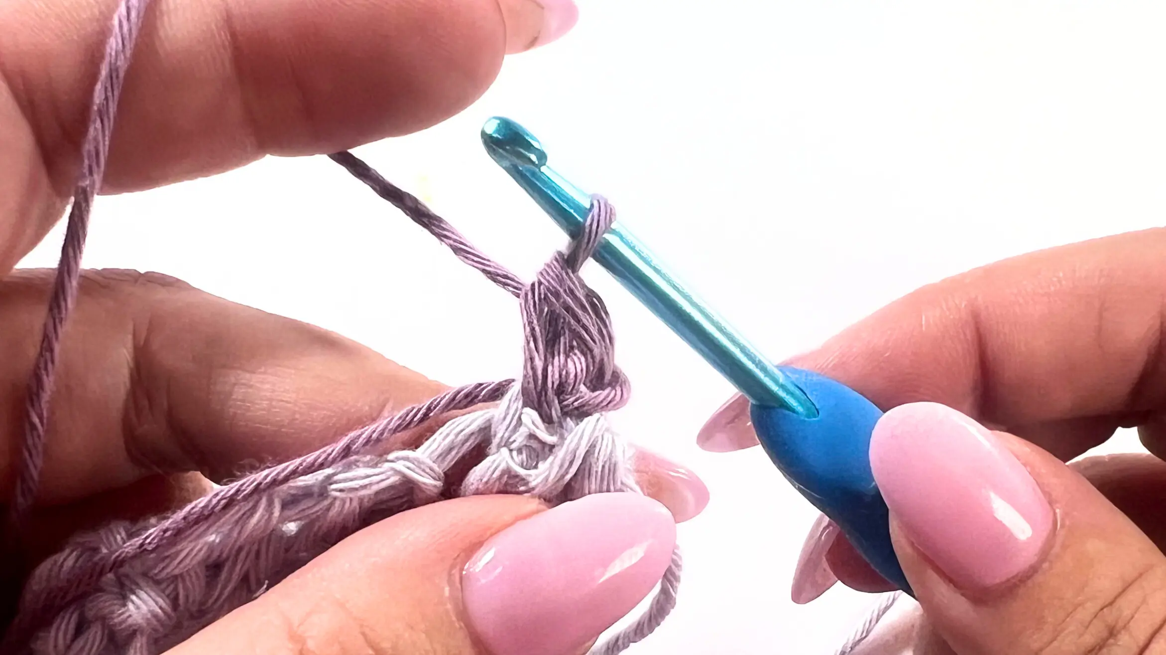 Close-up of first single crochet worked into the same stitch after chaining 1 to begin the Picot Border.
