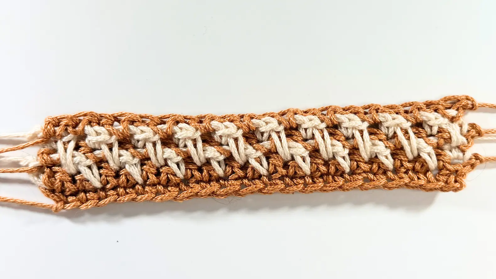 Back view of the completed Row 6 of the Honeycomb Stitch.