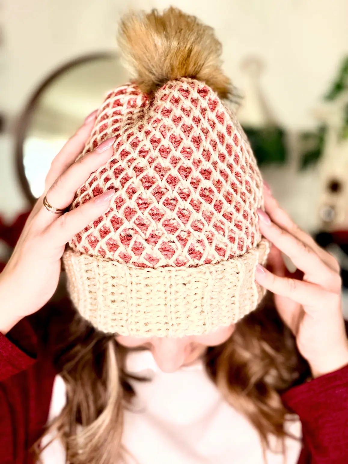 Honeycomb stitch crochet beanie showing textured pattern and gathered top with pompom