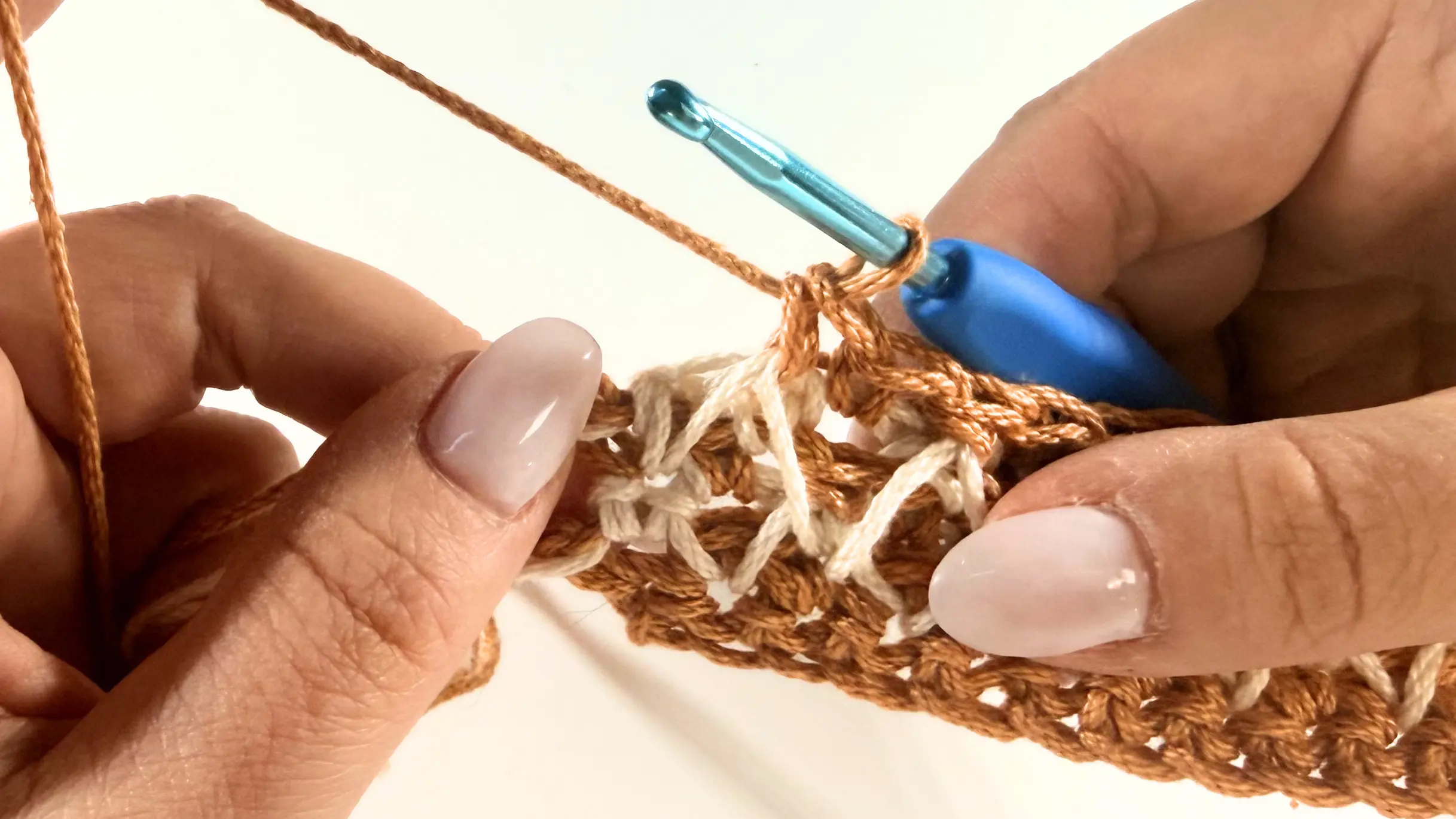 Making the last Single Crochet stitches to complete Row 6.