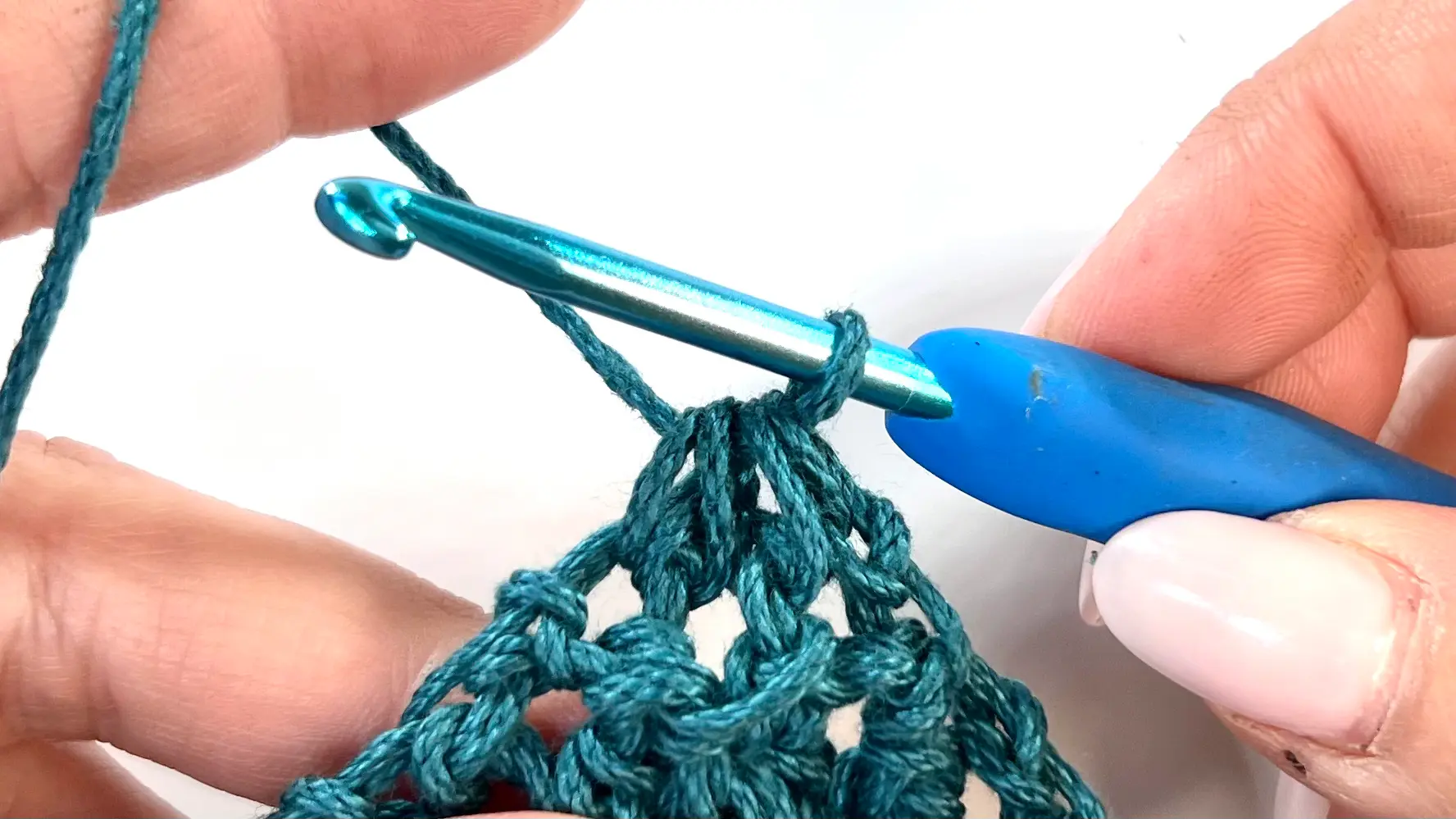 Completed C2C Even Moss Stitch square with clean edges and defined texture from alternating slip stitches and half double crochets; ready for fastening off.