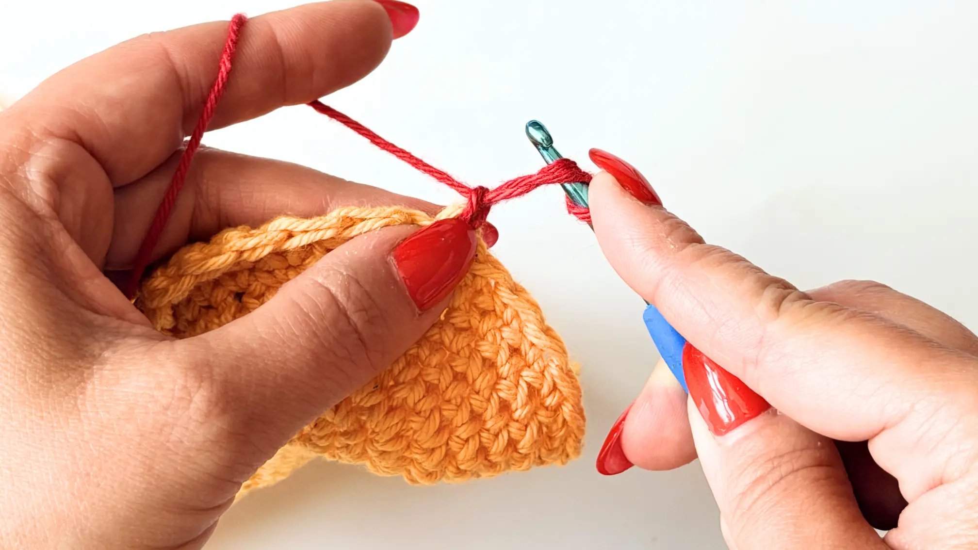 Wrap the long loop around the hook to create two loops.