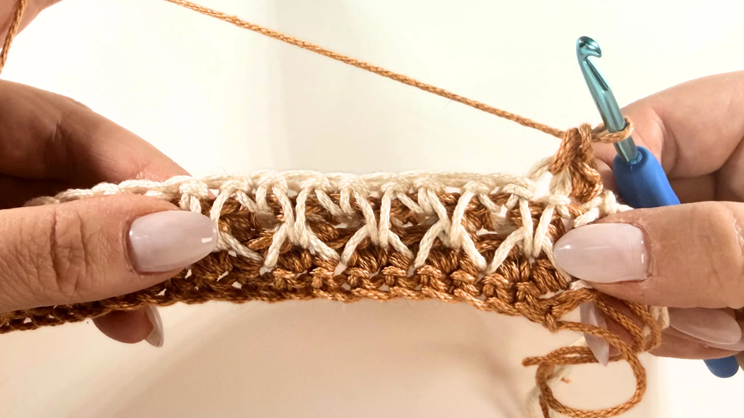 Completed first two Single Crochet stitches before connecting the first two legs of the Honeycomb Stitch.