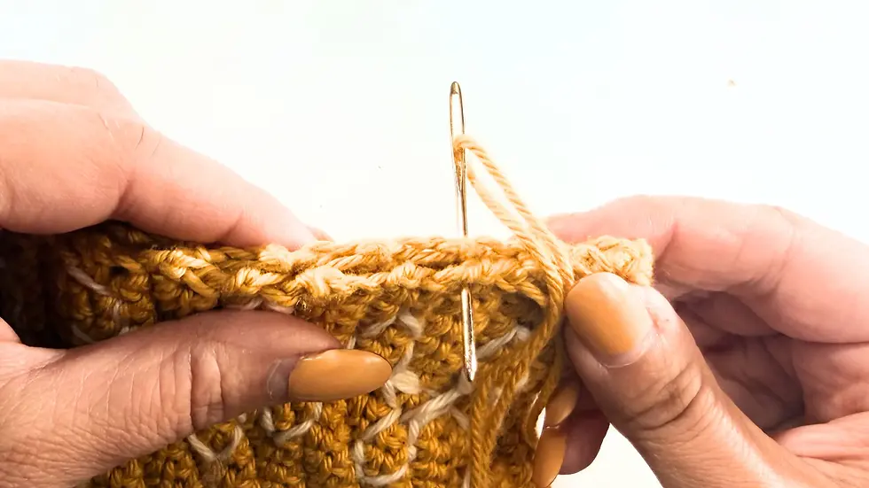 Whip stitch seaming used to join both sides of the leaf version of The Cozy Reader Sleeve.