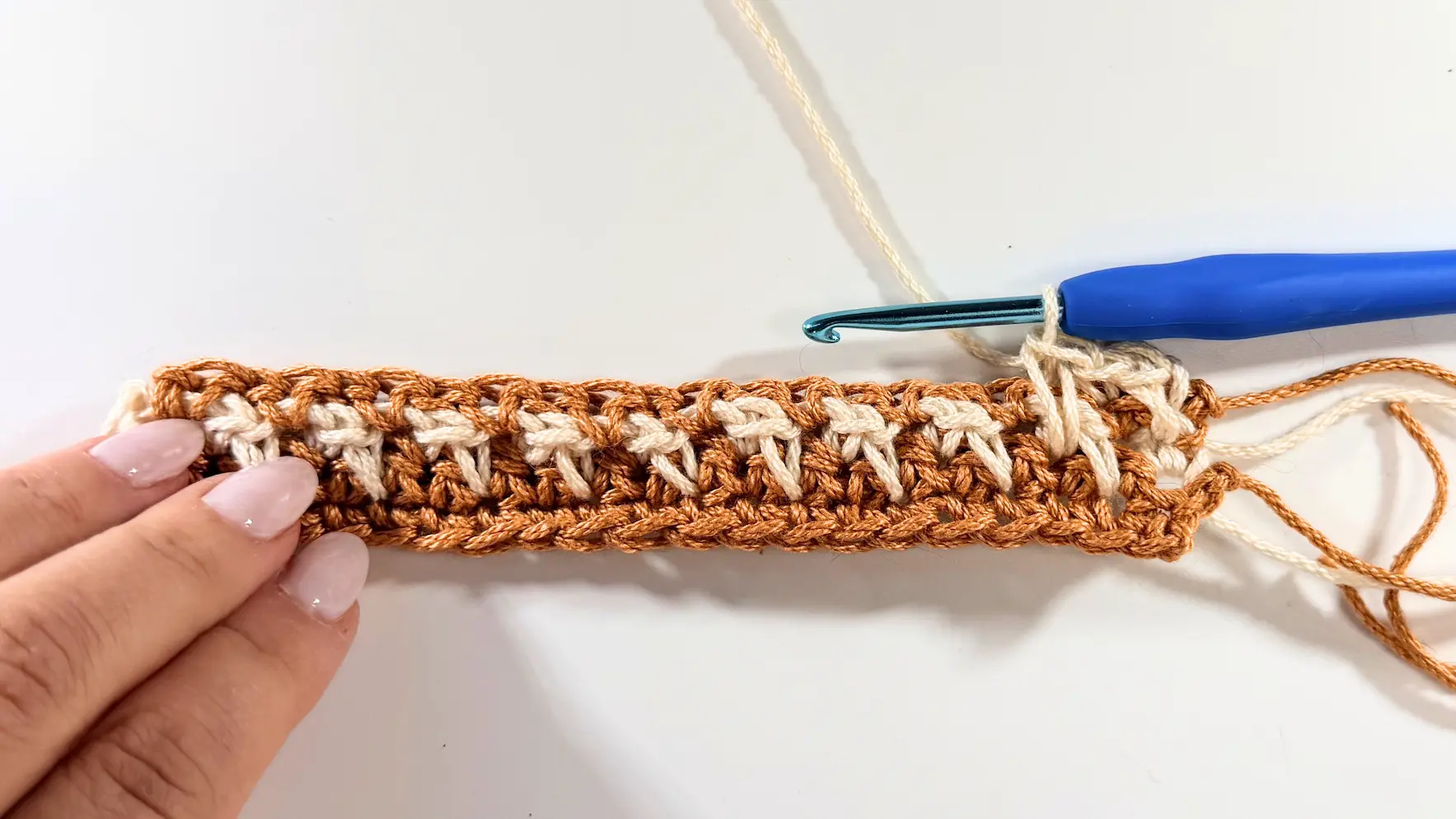 Continuing Row 5 by alternating Spike Stitches and Single Crochets across the row.
