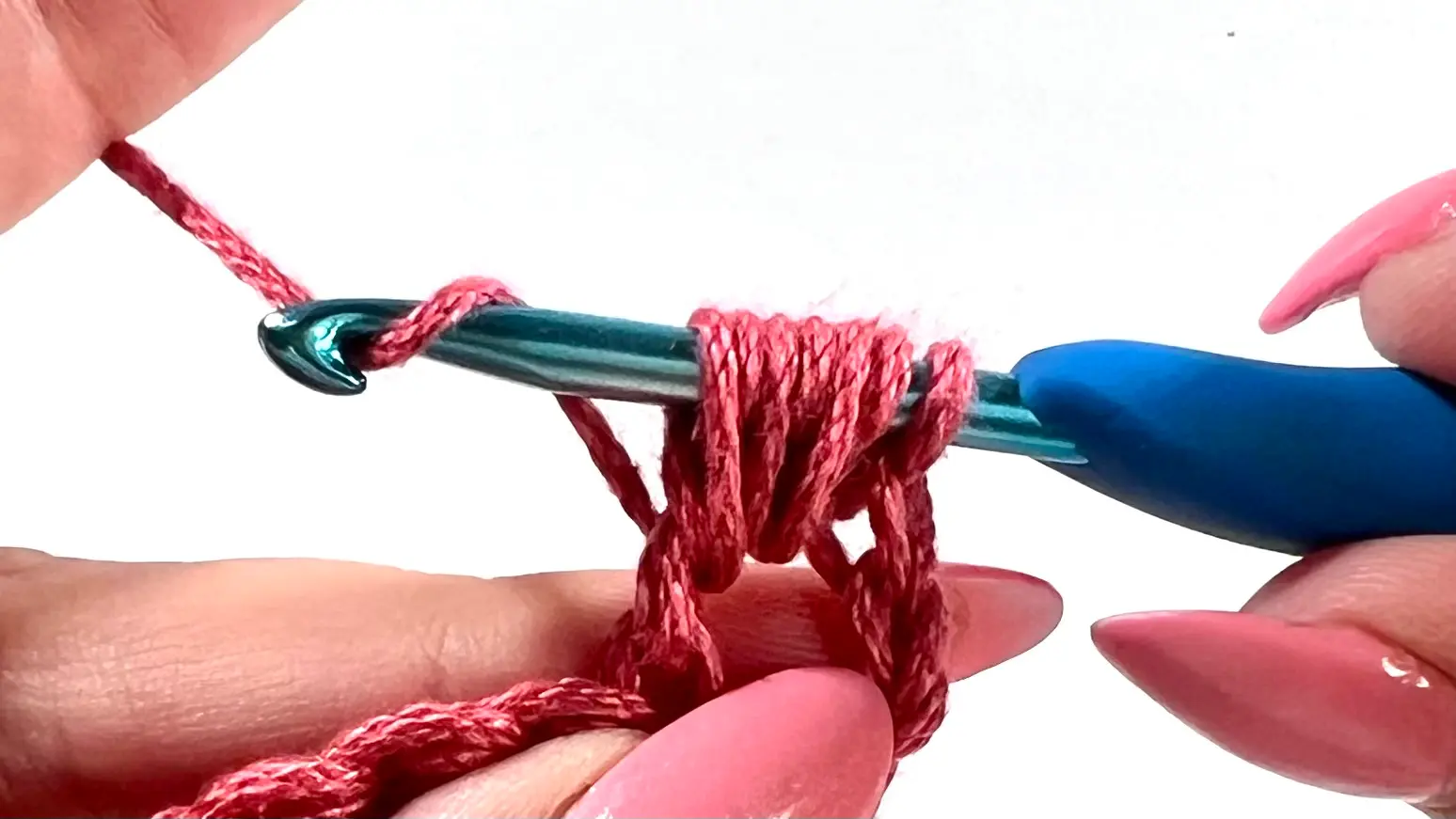 Hook holding 7 loops after completing all yarn overs for one bead stitch in crochet.