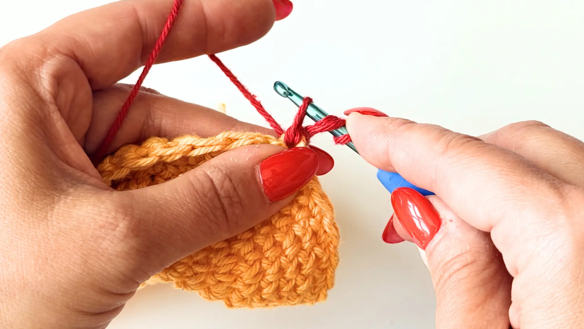 Yarn over and pull through the first two loops.
