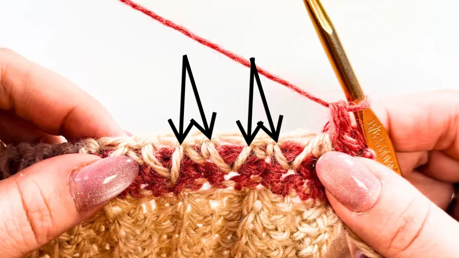 Honeycomb stitch crochet step showing where to insert the hook to connect the stitch legs