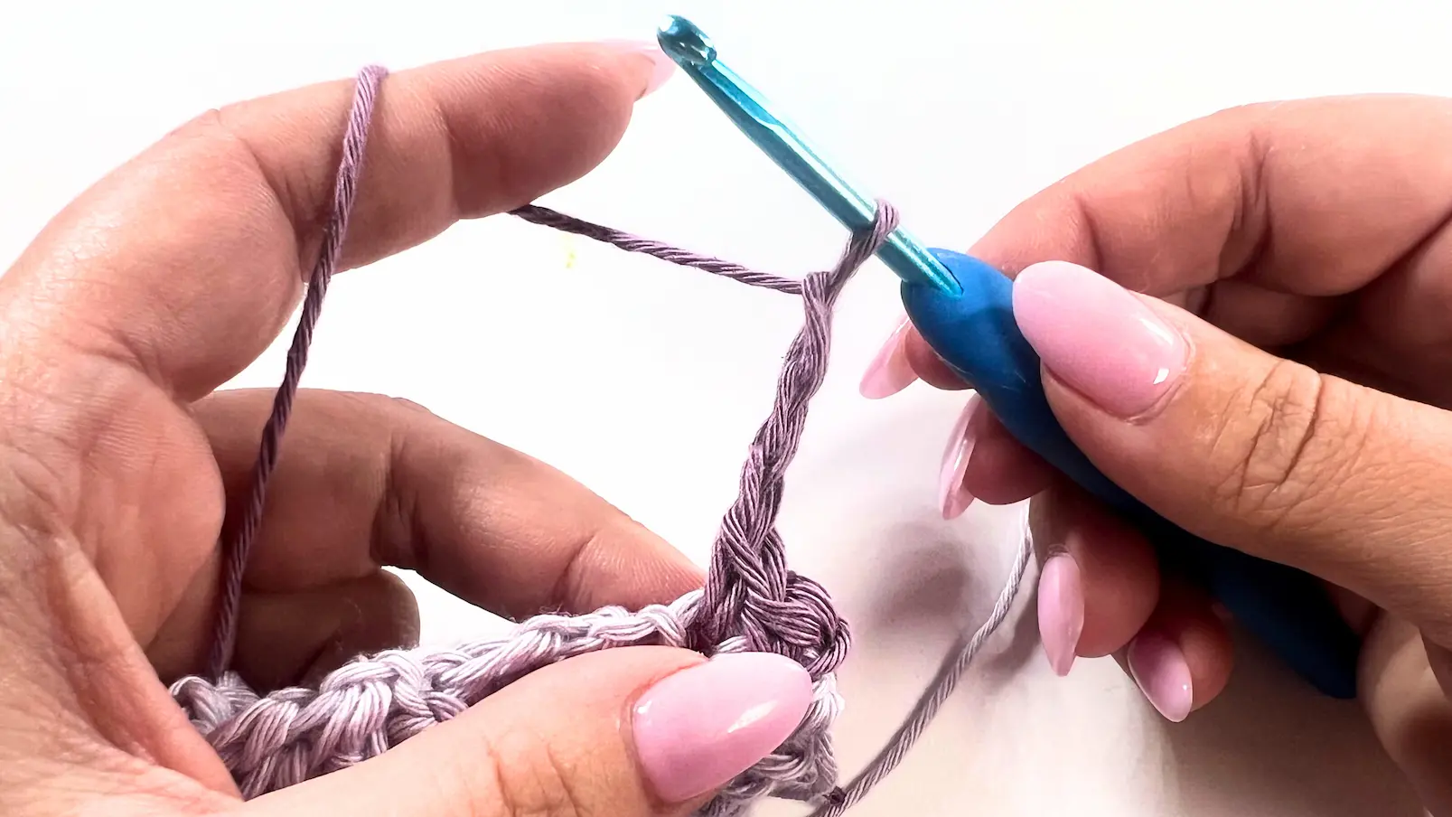 Yarn and hook forming a chain-3, which will be used to create the picot stitch.