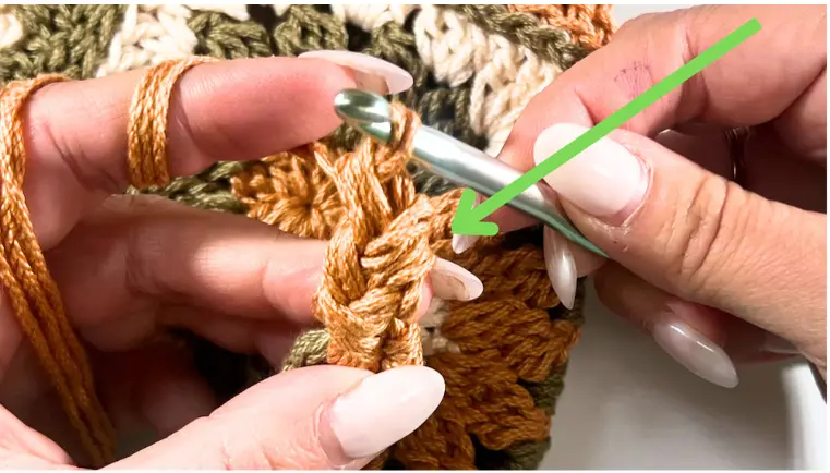 A close-up of the completed crochet strap segment with defined single crochet.