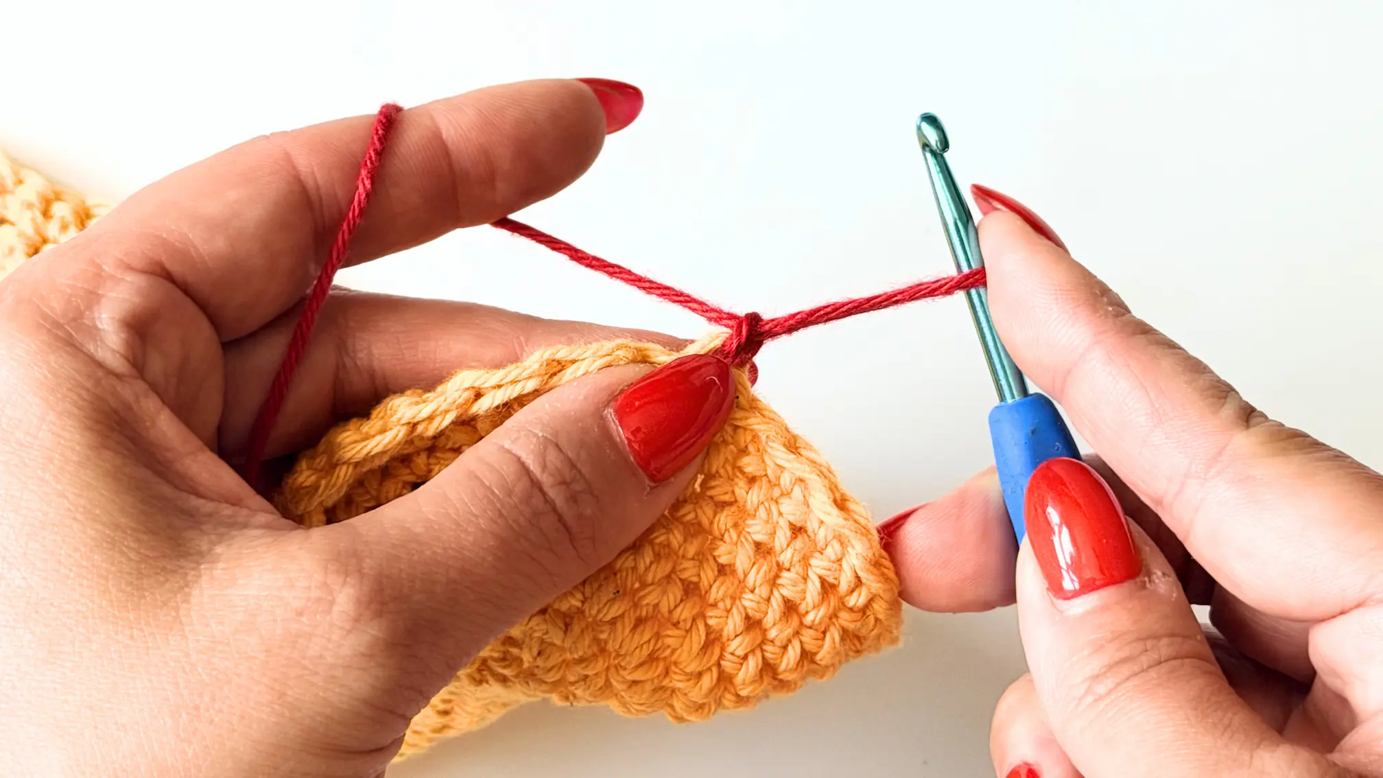 Hold the loop with your finger before continuing the invisible Double Crochet.