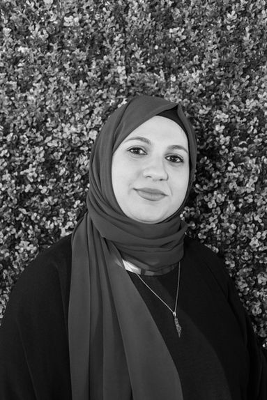 a Muslim woman in a black and white photo