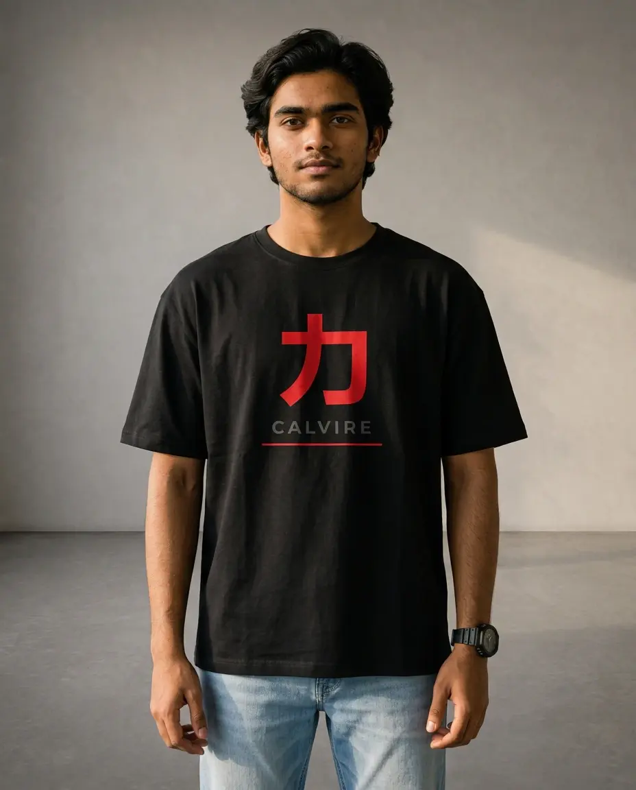 Man wearing a black Calvire oversized tee with a large red kanji character, grey lettering and red underline