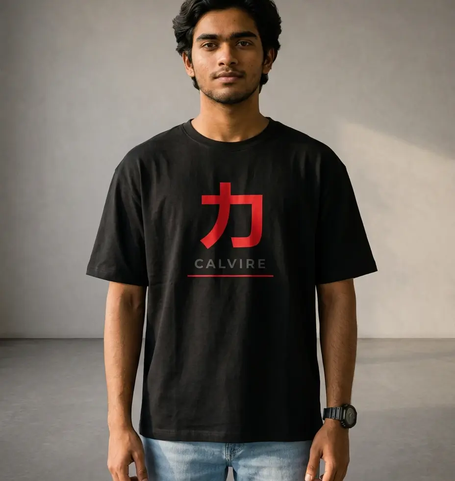 Man wearing a black Calvire oversized tee with a large red kanji character, grey lettering and red underline