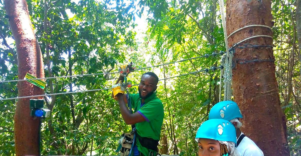Jamaican Guide experiencing the Zipline attraction In Mystic Mountain, Ocho Rios, Jamaica