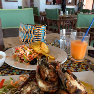 Seafood Lobsters and Fries and salad at Rock Restaurant,  Michamvi, Zanzibar