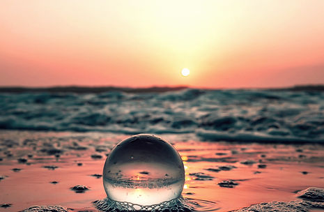 Relaxing glass ball On calm beach