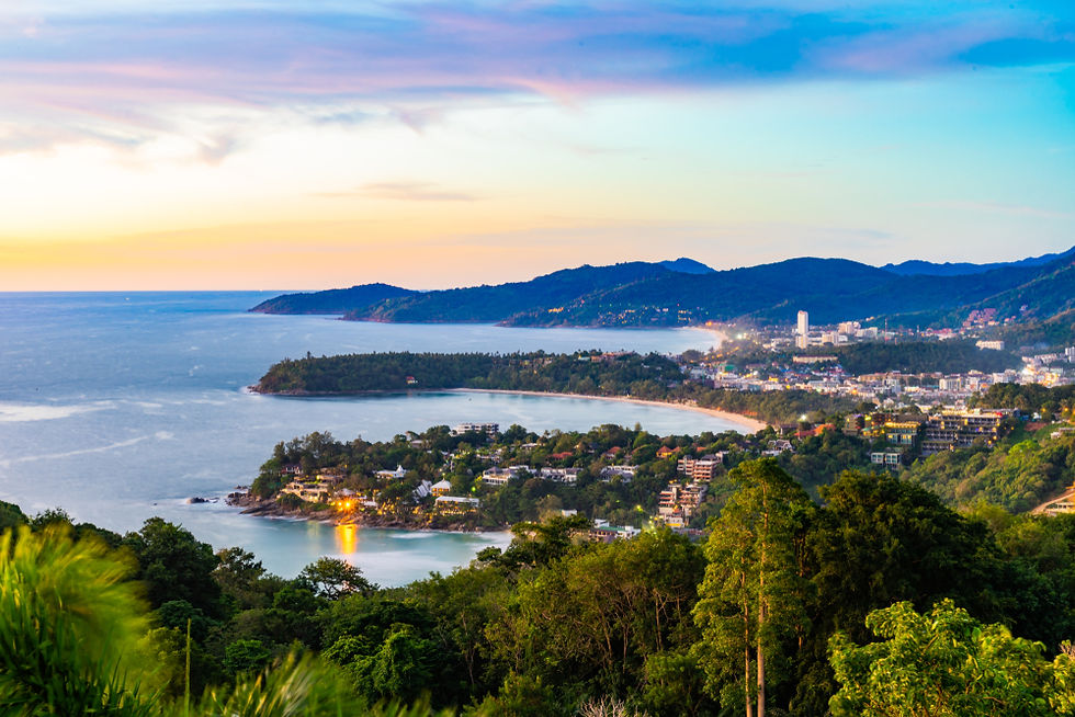 Panoramic view of Phuket coastline at sunset with Patong Beach and surrounding hills, Thailand