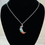 Thumbnail: 7 Chakra Stone Crescent Celestial Moon Necklace