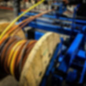 Machine cutting a large cable