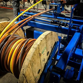 Machine cutting a large cable