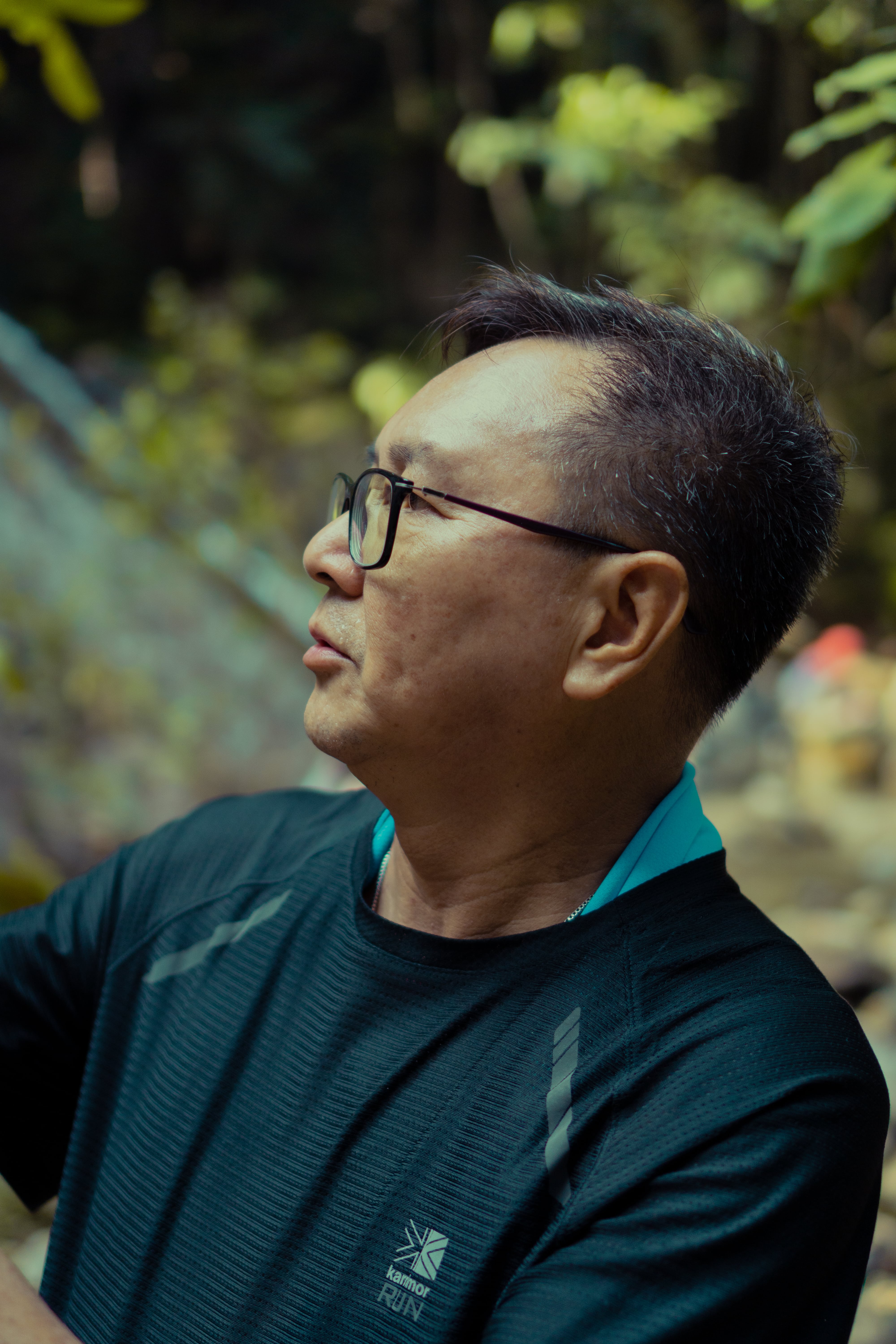 A hiker enjoying the view at the forest of Gunung Pulai at Johor