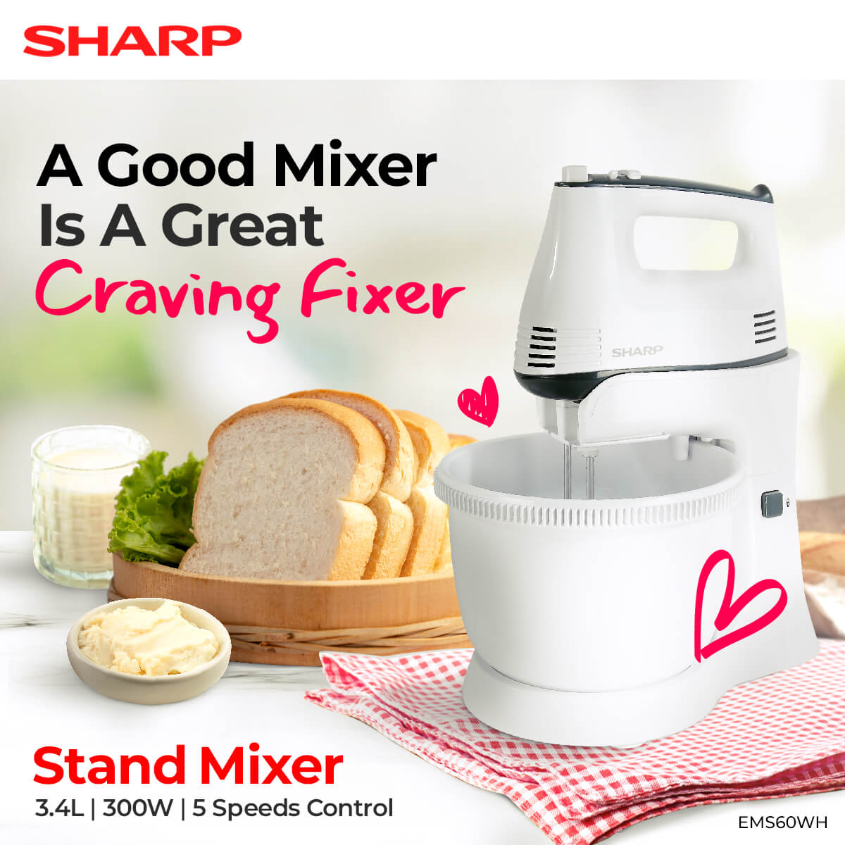 Sharp Stand Mixer on top of a red checkered table cloth with bread and butter at the side