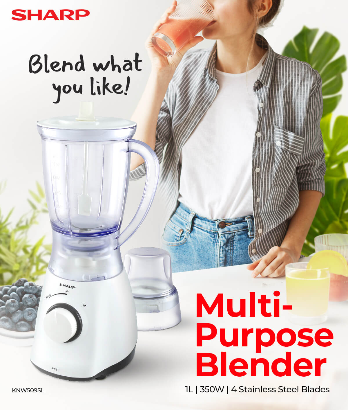a woman drinking fruit juices with Sharp multi-purpose blender infront, and some plant behind