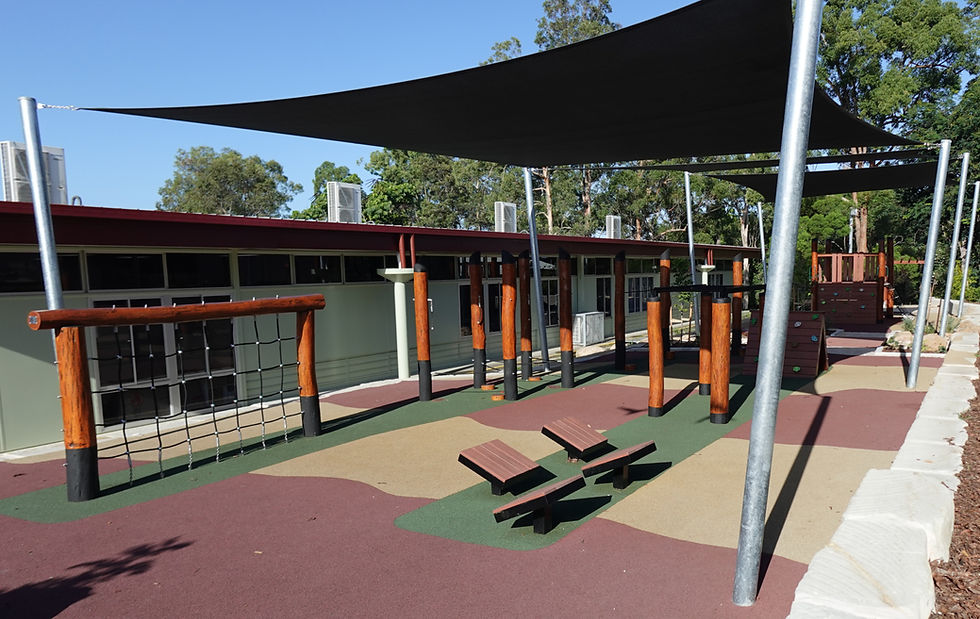 Eye-level view of the new senior playground with climbing walls and balance beams