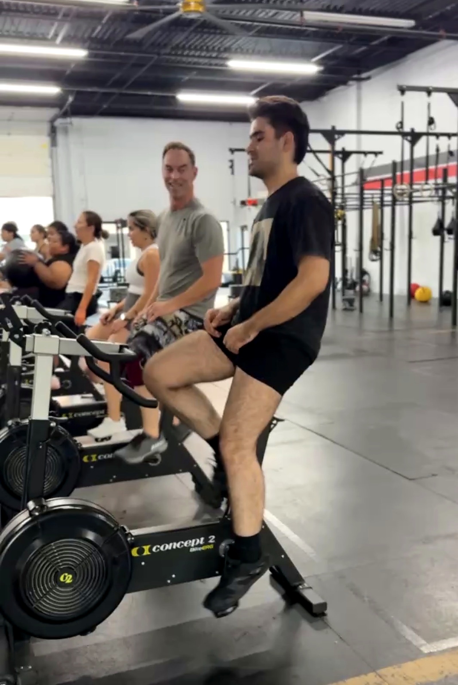 Cardinal CrossFit member riding a BikeErg during class
