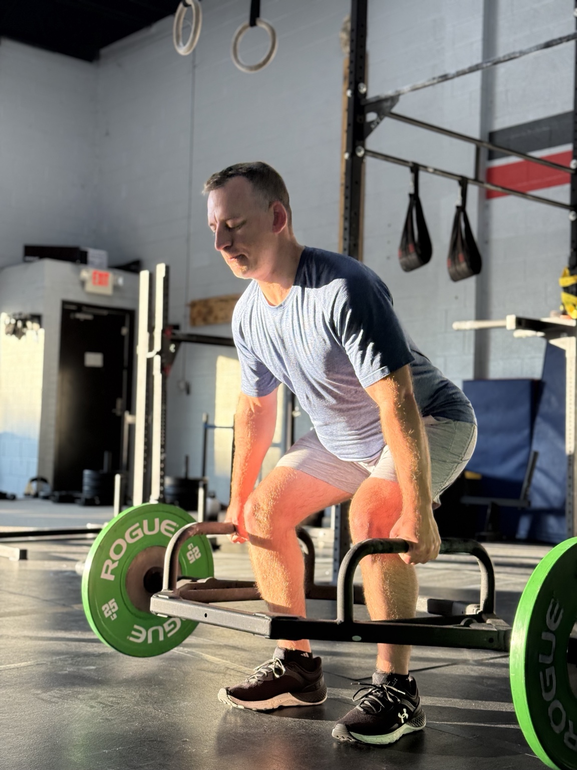 Cardinal CrossFit member training with a trap bar