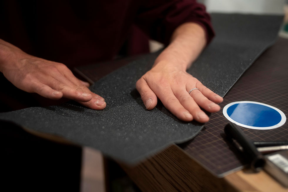hands-working-with-grip-tape-close-up.jpg
